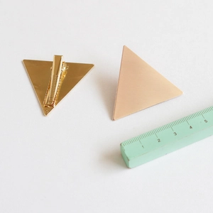 Minimalist geometric metal triangle hair clips in matte rose gold and gold finishes