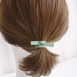 Green fabric bow hair tie on ponytail, minimalist elastic hair scrunchie set for women