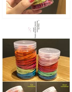 Detail of colorful elastic hair ties in tall and short transparent plastic jars