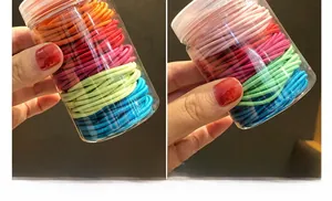 Detail of colorful high elasticity hair ties packed in a transparent plastic jar
