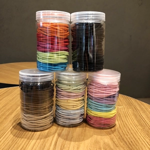 5-pack storage jars of colorful elastic hair bands in assorted macaron and earth tones