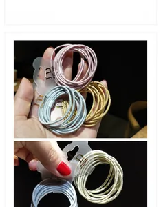 Close-up of high-elastic multi-color hair ties in macaron shades with branded cards