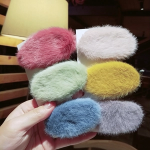 Close-up of colorful plush faux fur BB hair clips in six vibrant shades for women