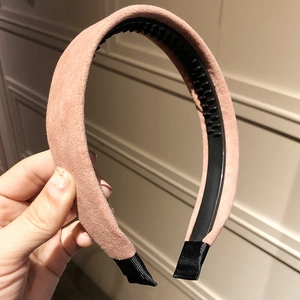 Pink matte headband detail showing soft velvet texture and black anti-slip inner lining