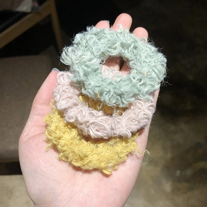 Three-piece set of fluffy fleece hair scrunchies in green, pink, and yellow colors