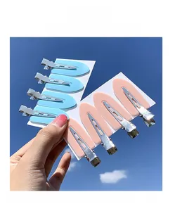 Close-up of candy color seamless hair clips in sky blue and light pink matte finish