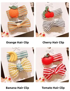 Set of fruit-themed bow hair clips featuring orange, cherry, banana, and tomato designs