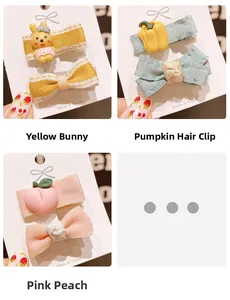 Detail of cute cartoon hair clips including yellow rabbit, pumpkin, and pink peach styles