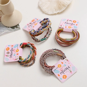Elastic braided hair bands in assorted Morandi colors on brand display cards