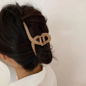 Minimalist matte apricot plastic hair claw clip with cross design for women's hairstyle