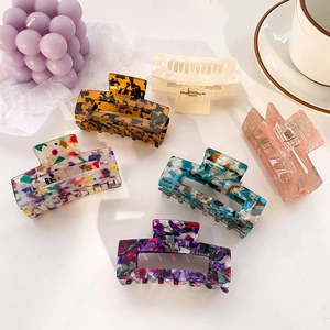 Large acetate hair claw clips in floral and tortoiseshell patterns for women