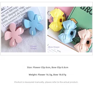 Detailed view of candy color flower and bow hair claws in macaron tones with glossy finish