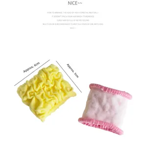 Detail showing elastic hair scrunchies with 5cm-6cm width and ribbed knit texture