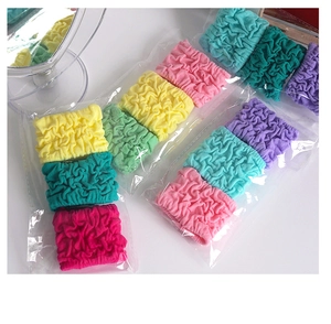 Macro detail of elastic bubble hair ties in vibrant colors with wavy textured finish