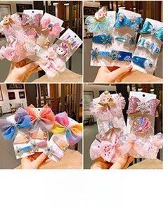 Detail of glittery bow hair clips and resin snowflake accessories for girls' hairstyles