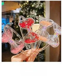 Close-up of clear butterfly headbands filled with colorful beads for children