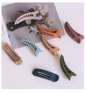 Set of eight matte finish hair clips in various macaron and morandi colors for styling