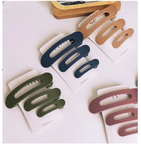 Detail view of 3-piece matte hair clip sets in Morandi colors on display cards