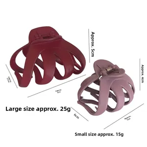 Comparison of large burgundy and small lavender matte octopus hair claw clips with sizes