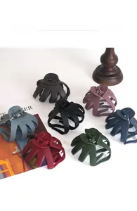 Detailed overhead view of large matte octopus hair claws in seven assorted elegant colors