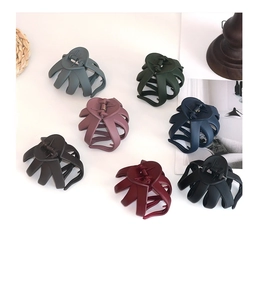 Detailed top view of large matte octopus hair claws in seven assorted trendy colors