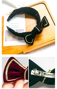 Close-up of velvet bow hairclip with gold wire trim and metal spring clip details