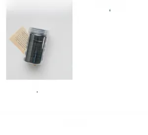 Detailed view of elastic hair ties in a transparent cylindrical box for hair styling