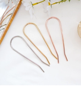 Three minimalist U-shaped hair pins in gold silver and rose gold metal finishes