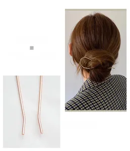 Detail of rose gold U-shaped hair pin and back view of elegant bun hair style