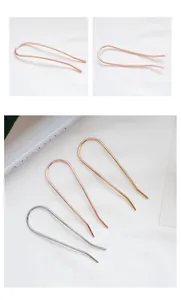 Detail view showing gold, rose gold, and silver U-shaped metal hair pins for elegant buns