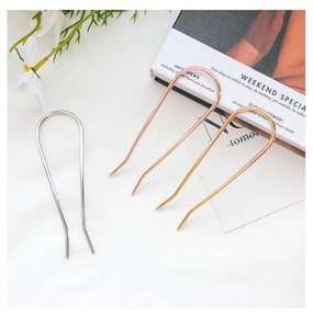 Three minimalist U-shaped metal hairpins in gold, rose gold and silver finishes