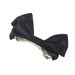 Elegant black satin bow hair clip with smooth texture and silver metal spring fastener