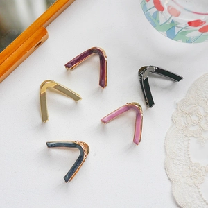 Elegant V-shaped metal hair clips in various colors with polished enamel finish