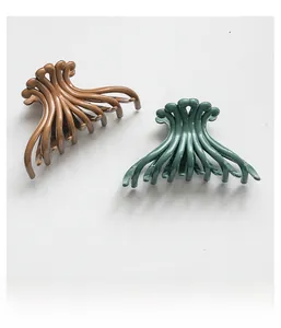 Detail of coffee and dark green octopus hair claws for thick hair styling
