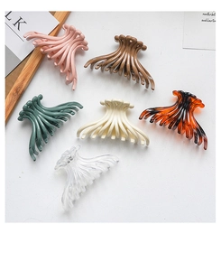 Close-up of large octopus hair claws in six Morandi colors including amber and ivory