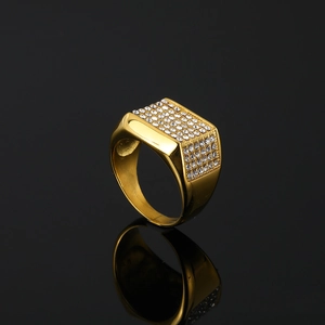 Men's hip hop gold plated stainless steel ring with white crystals on black background
