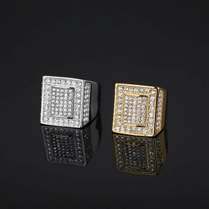 Hip hop style gold and silver square rings with full crystal pavé on black background