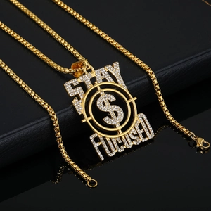Hip hop iced out gold pendant necklace with Stay Focused lettering and dollar sign
