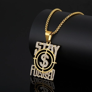 Iced out gold Stay Focused hip hop pendant necklace with dollar sign on black background