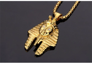 Detailed relief of Egyptian Pharaoh pendant with white zircon eyes on gold box chain