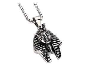 Detail of vintage silver Egyptian Pharaoh Tutankhamun pendant with oxidized relief texture