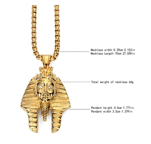 Macro view of gold Egyptian Pharaoh pendant with cubic zirconia eyes on box chain