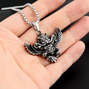 Detailed relief of vintage mythical bird pendant with oxidized finish and box chain