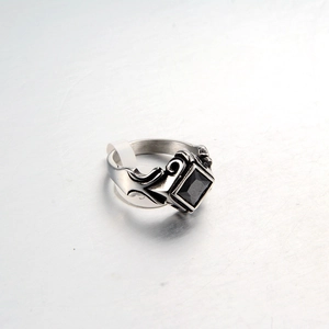 Punk style stainless steel ring with square black gemstone and gothic relief textures