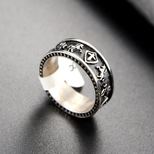 Detailed view of punk shield and horse relief on vintage silver finish stainless steel ring