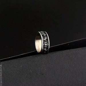 Detailed view of punk style shield and war horse engraving on vintage silver ring