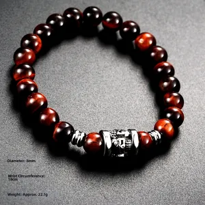 Detail view of 8mm red tiger eye bead bracelet with silver metal cylinder and 18cm wrist size