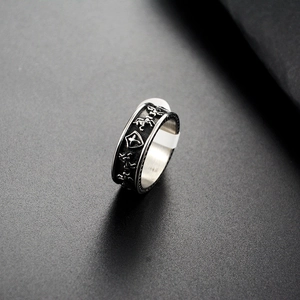 Macro shot of vintage steel ring featuring embossed stallion and star shield details