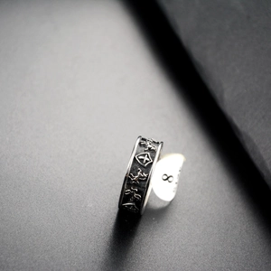 Macro detail of punk shield horse ring showing medieval relief and vintage texture