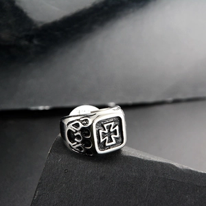 Macro shot of punk cross pattern square ring in vintage steel with engraved 925 stamp